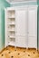 White wardrobe in classical style with inner shelves