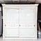 White wardrobe with sliding doors, drawer and shelves, vintage style