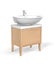 White wash basin with tap mounted on wooden cabinet