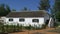 A white wash country cottage with reed roof