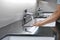White washbasin and faucet on counter with hand washing
