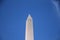 The white Washington Obelisk monument in the blue sky