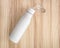 White water bottle on wood background. Insulated container for keep your drink.