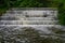 White Water flowing over weir low level view at long exposure