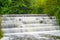 White Water flowing over weir low level view at long exposure