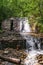 White waterfall and rockery stone masonry wall