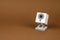 White webcam on brown background, object, Internet, technology c