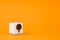 White webcam on orange background, object, Internet, technology concept