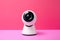A white webcam on ready to record video on a colorful pink paper background with copy space. Online communications concept. Modern