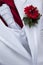 White wedding bridegroom coat with red flower