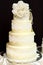 White wedding cake decorated with white lace