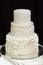 White wedding cake decorated with white pearls