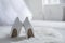 White wedding shoes on furry rug in room, back view. Space for text