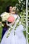 White weddng flowers over blured bride background