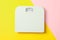 White weigh scales on two tone background