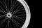 A white wheel of a bicycle