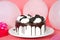 White whipped cream frosted cake with chocolate cream filled sandwich wafer cookies party scene