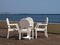 White wicker chairs on a hotel terrace