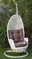White wicker hanging egg chair