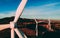 White Wind Turbines or Modern Windmills in the mountains landscape