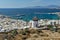 White windmill and Mykonos town, the island of Mykonos, Cyclades