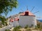 White windmills in a row with Chora,Astypalaia at the background