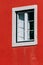 White window frame of the red stone building, the architecture of Lisbon, Portugal