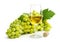 White wine in a glass with a large brush of green grapes