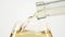 White wine pouring in a glass from a bottle, white, closeup, slowmotion