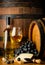 White wine on wooden barrel background