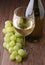 White wineglass and grape