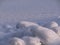 White winter background. Snow surface in perspective. Lumps of snow on the frozen surface of the lake.