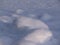 White winter background. Snow surface in perspective. Stones covered with snow on the lake.