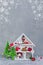 White winter magical wooden cupboard with christmas toys and presents, cone, alarm clock, branches of fir-tree, postcard