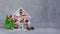 White winter magical wooden cupboard with christmas toys and presents, cone, alarm clock, branches of fir-tree, postcard