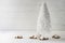 White wire christmas tree decoration and cinnamon star cookies a