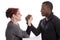White woman and black man doing arm wrestling