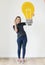 White woman with lightbulb icon isolated on background