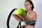 white woman prepares to serve in tennis. tennis ball and racket in the foreground