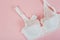 White women underwear with lace on pink background. whitebra and pantie.Copy space. Beauty, fashion blogger concept. Romantic