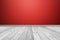 White wood floor panels with red wall background