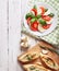 White wooden background with italian traditional caprese salad