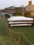 White wooden boats stored outdoors