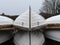 White wooden boats stored outdoors