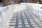 White wooden bridge with shadows from the sun is very graphic in winter