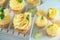 White wooden crate and delicious lemon cupcakes on table