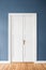 White wooden door, blue wall -