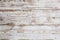 White wooden floorboards. Distressed worn floorboard background painted white