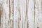 White wooden floorboards. Distressed worn floorboard background painted white