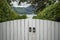 White wooden gate with metal handles in the courtyard in the Alpine village, Austria